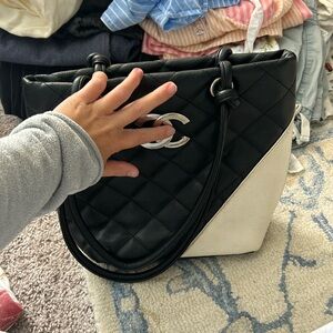 Black and while faux leather quilted bag